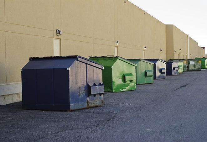 red and green waste bins at a building project in Liberty